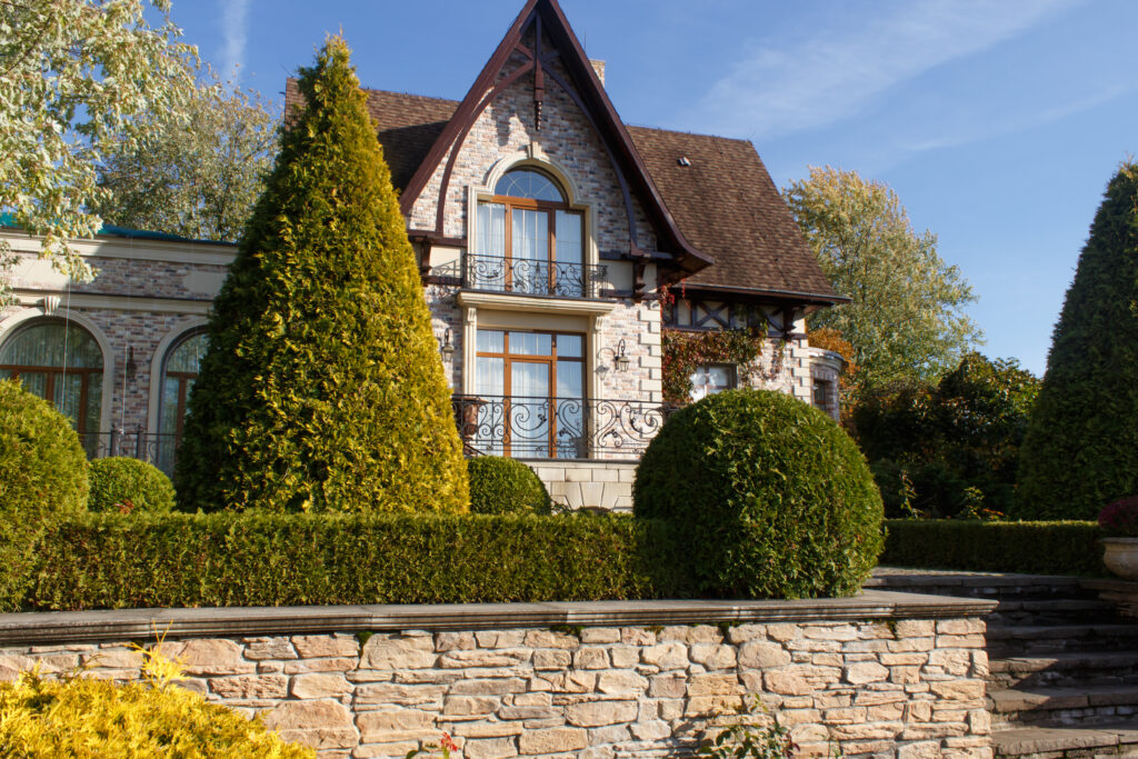 Stone retaining walls used to stabilize a landscaped garden.